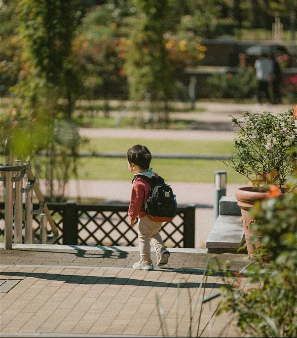 A child setting off with a backpack