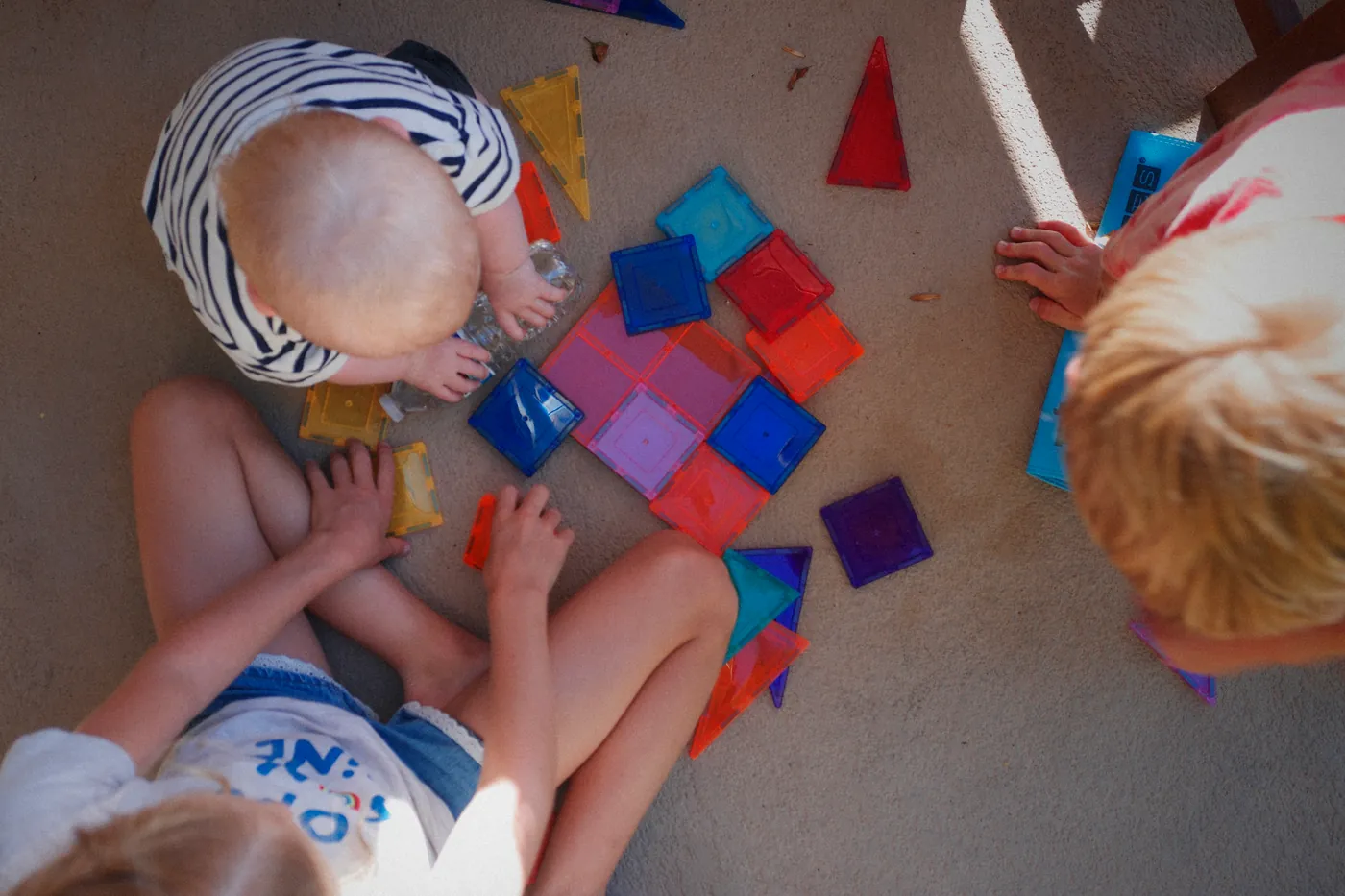 Magnet tiles with her brother
